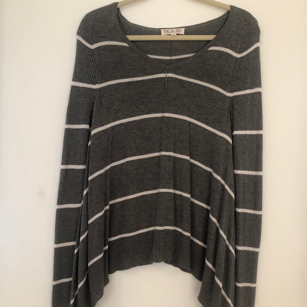 Grey sweater with white stripes
